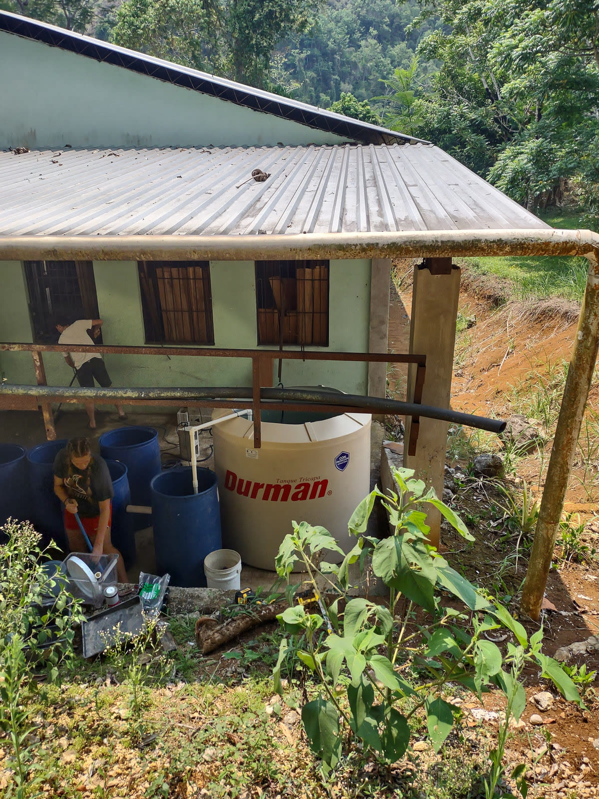 A water tank system installed beside a house