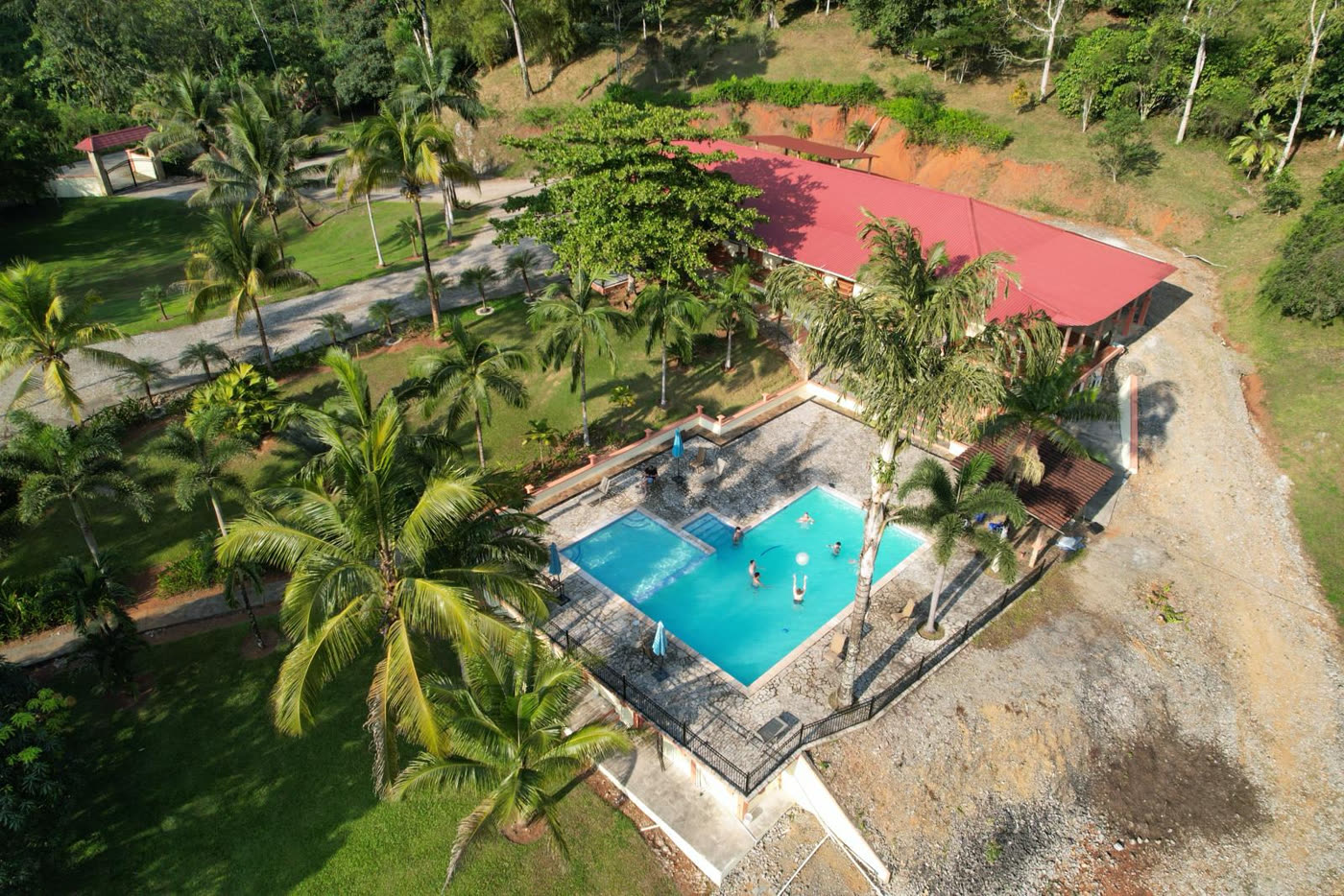 Aerial view of El Puente with its swimming pool and red-roofed building