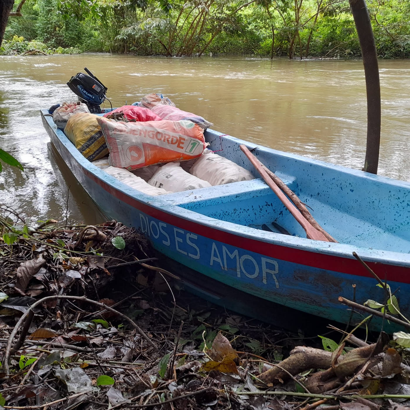 The Corn Boat loaded with sacks of corn at the river's edge