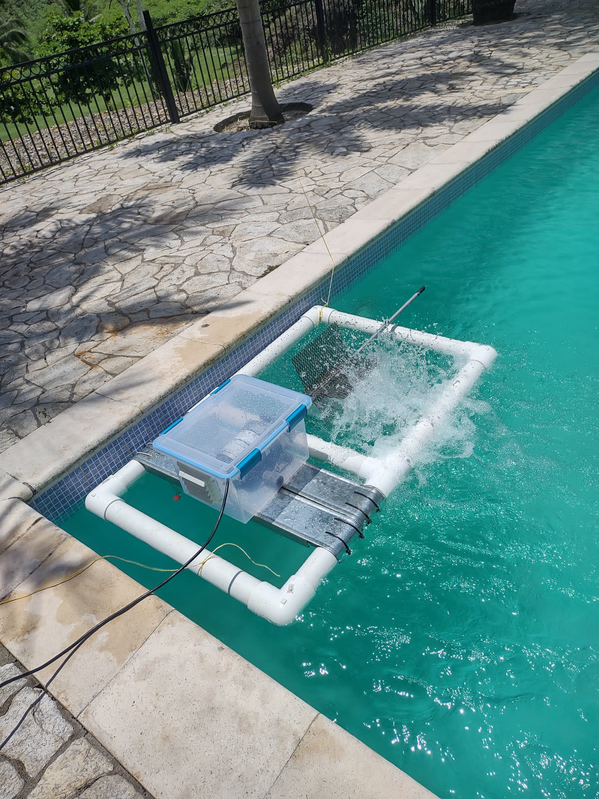 Paddle-wheel aerator prototype being tested in a swimming pool