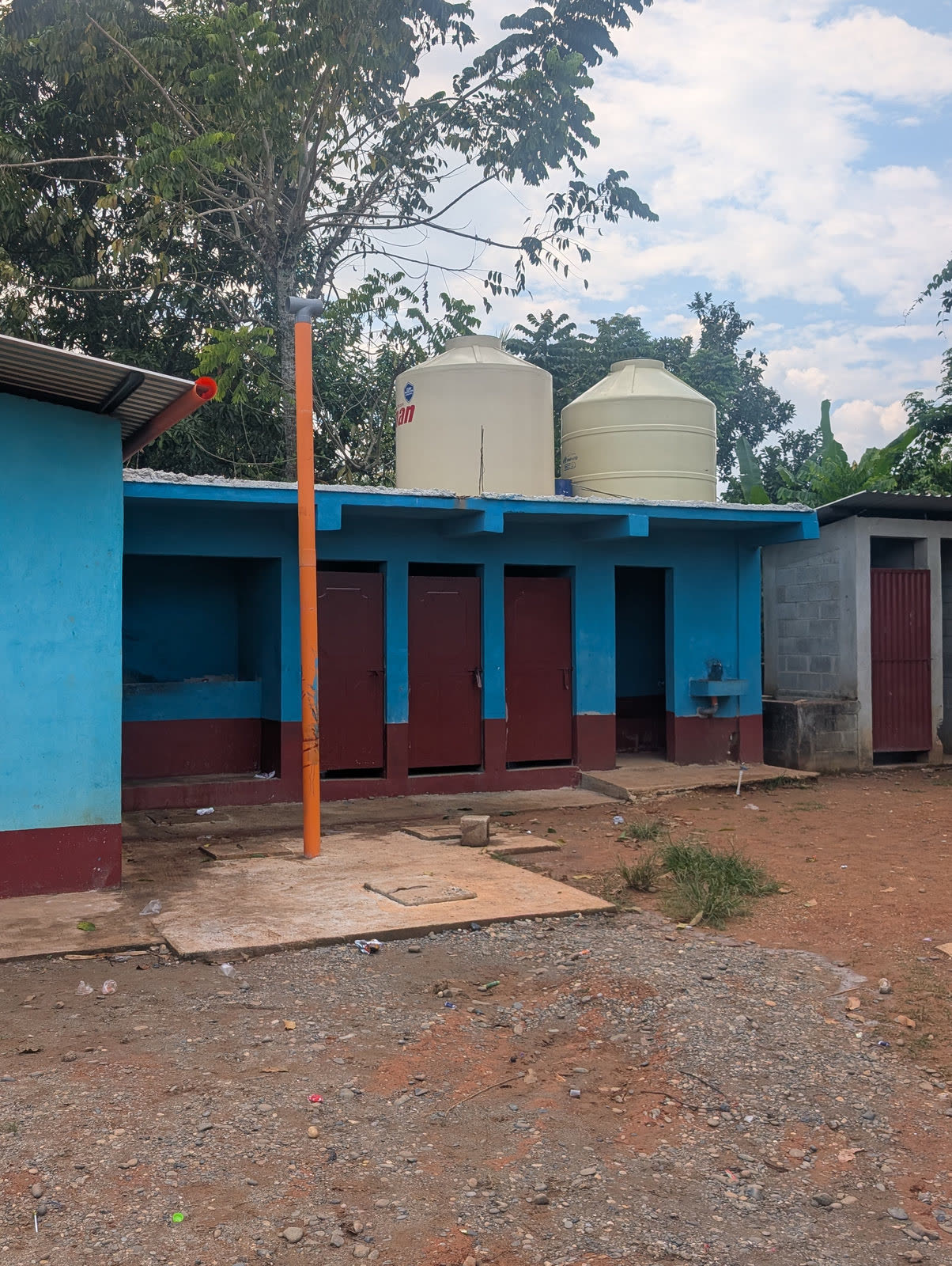 School restroom block with water tanks on the roof
